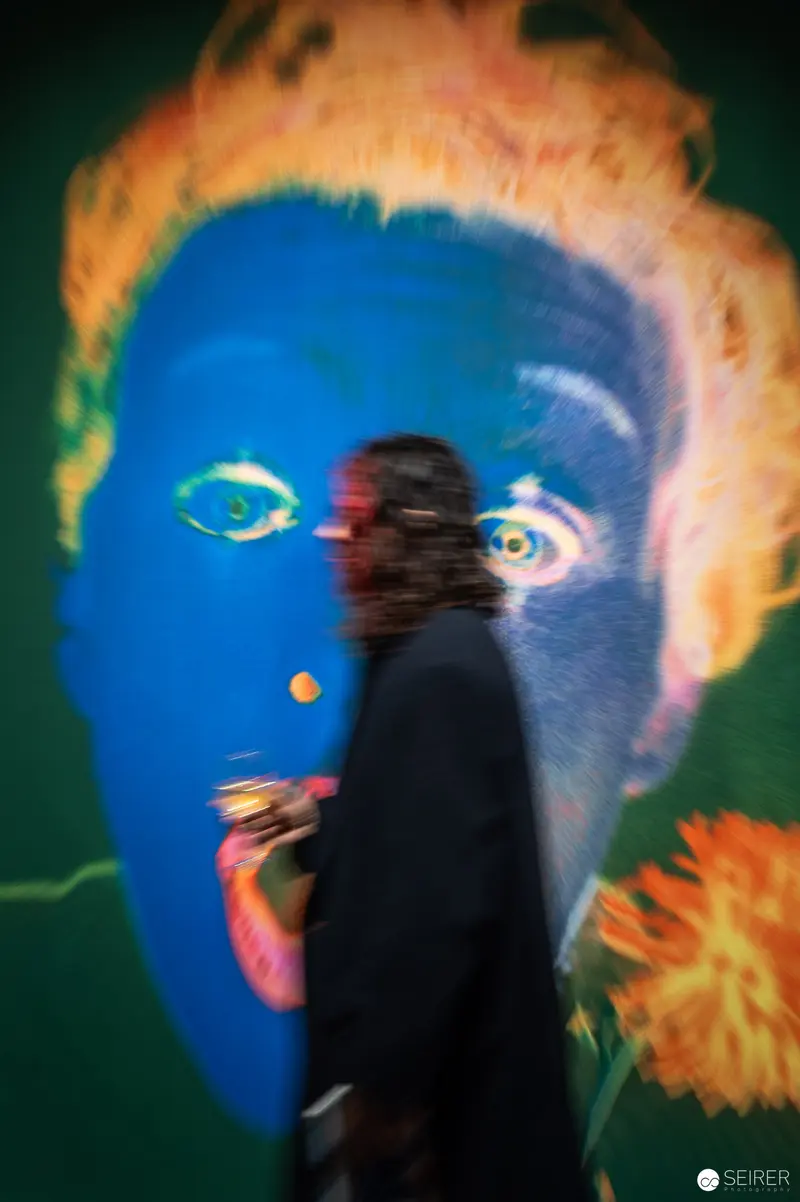 René Groebli Exhibition: Silhouetted Viewer Before Surreal Blue Portrait at Westlicht