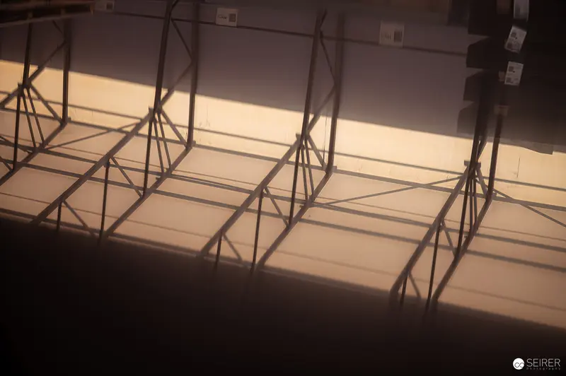 Industrial Steel Frame Silhouettes in Dramatic Sepia-Toned Lighting