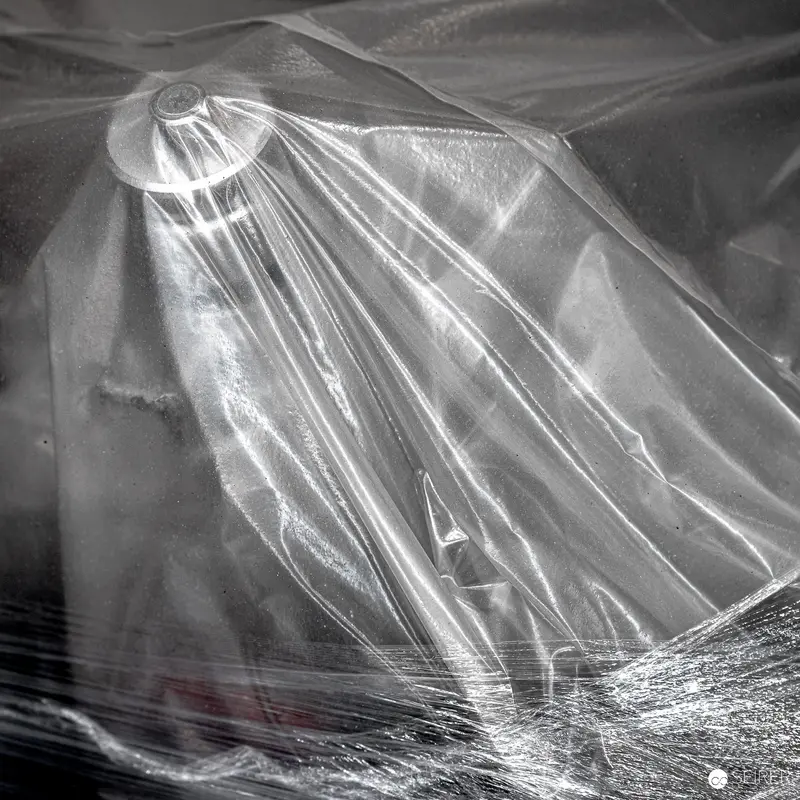 Translucent Sculptural Form Draped in Ethereal Light and Texture