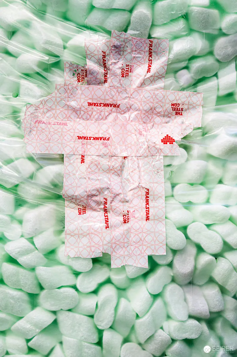 Packing Peanuts and Shipping Packets Arranged in Industrial Packaging Composition