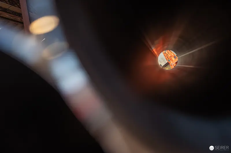 Glowing Industrial Reflective Surface with Blurred Foreground Metallic Object