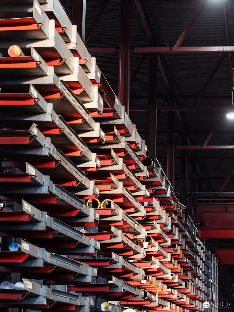 Industrial Steel Storage Rack System with Modular Red and Gray Shelving