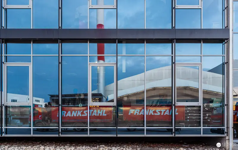 Frankstahl Industrial Facility Glass Facade with Reflective Urban Architectural Elements
