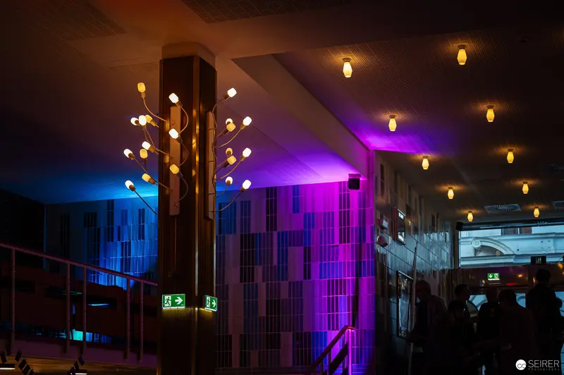 Nighttime Urban Architecture with Vibrant Lighting and Purple Accents