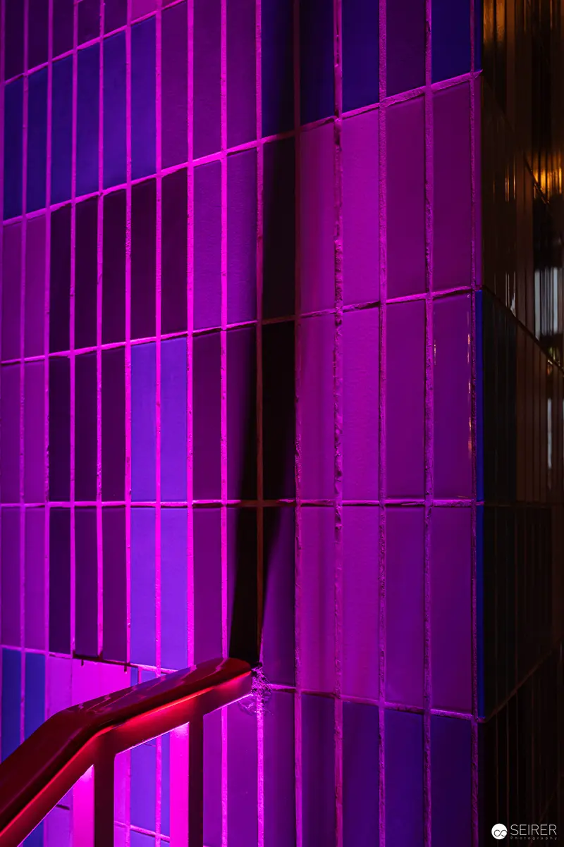 Purple-Lit Architectural Interior with Dramatic Lighting and Geometric Lines