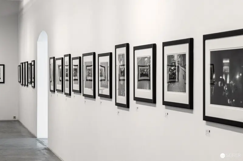 Gallery Exhibition of Black and White Photographs in Minimalist White Space
