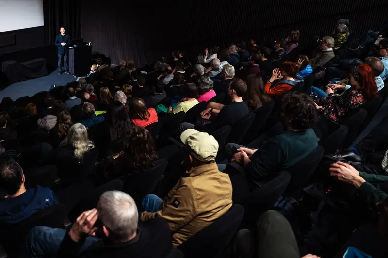 Film Museum 60th Anniversary Event: Audience Gathered for Presentation
