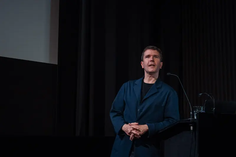 Speaker at 60 Years of Filmmuseum Event in Blue Jacket