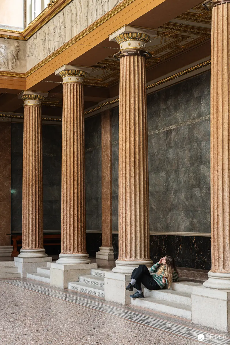 Classical Columns and Solitary Figure at Akademie der bildenden Künste Exhibition