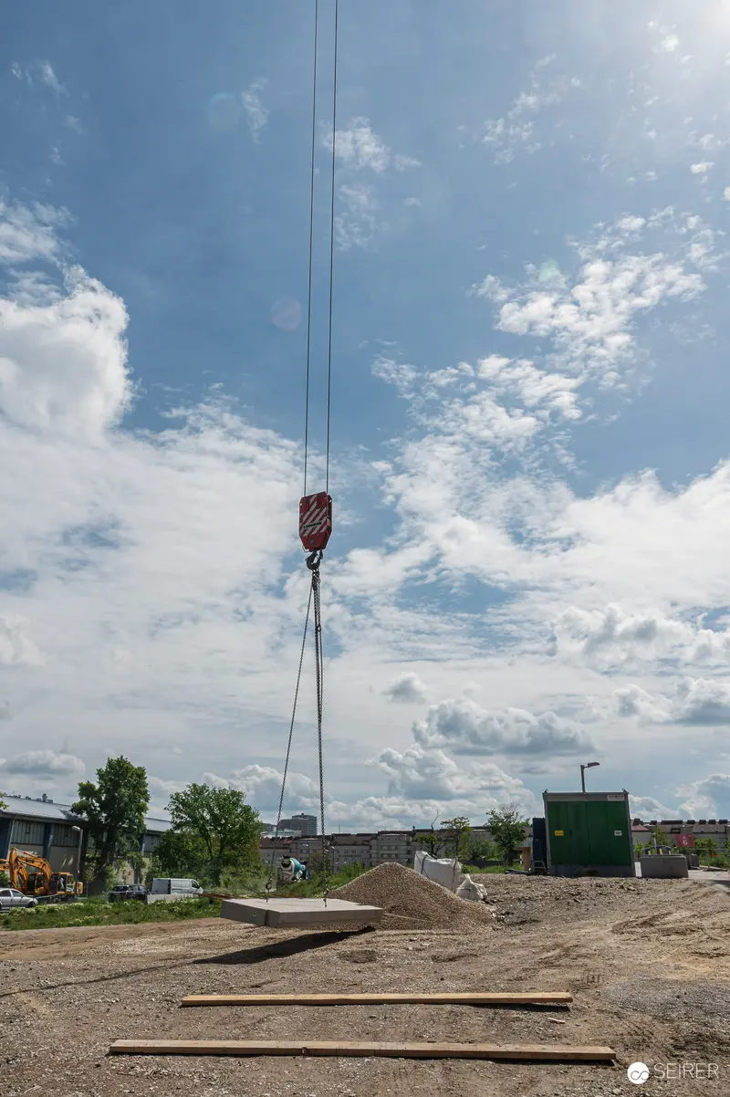 Crane Hook and Construction Materials at Active Building Site