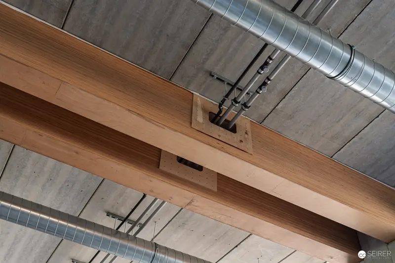 Exposed Timber Beam and Concrete Ceiling in Industrial Construction