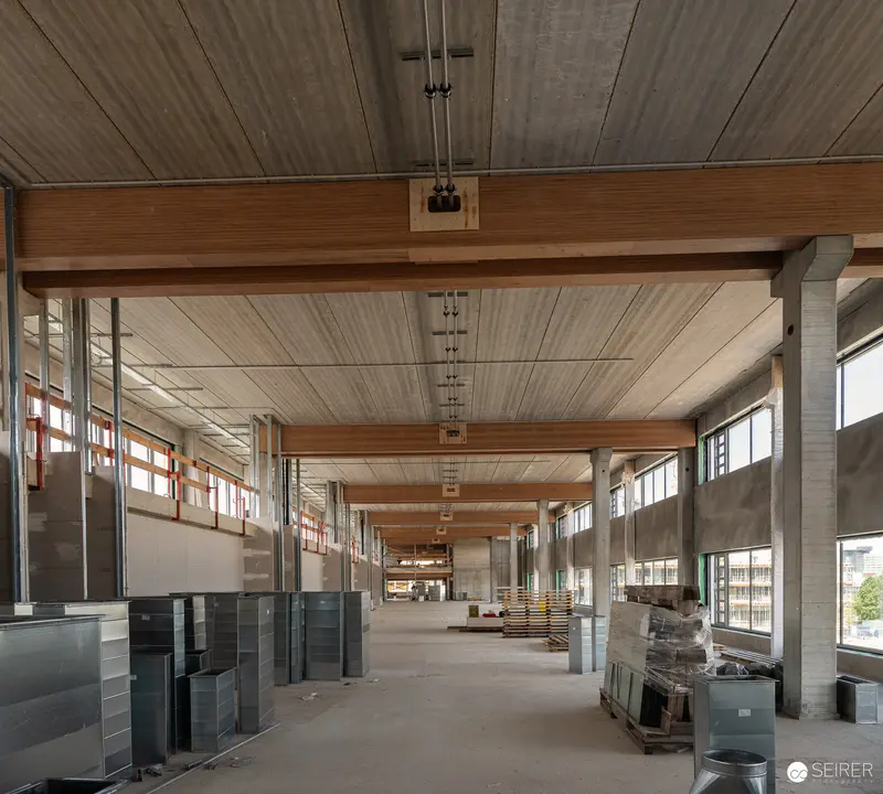 Modern Industrial Construction Site Interior with Exposed Timber Ceiling