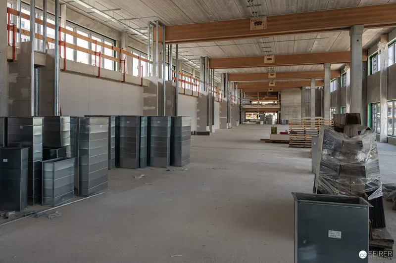 Large Commercial Building Interior Under Construction with Exposed Framework