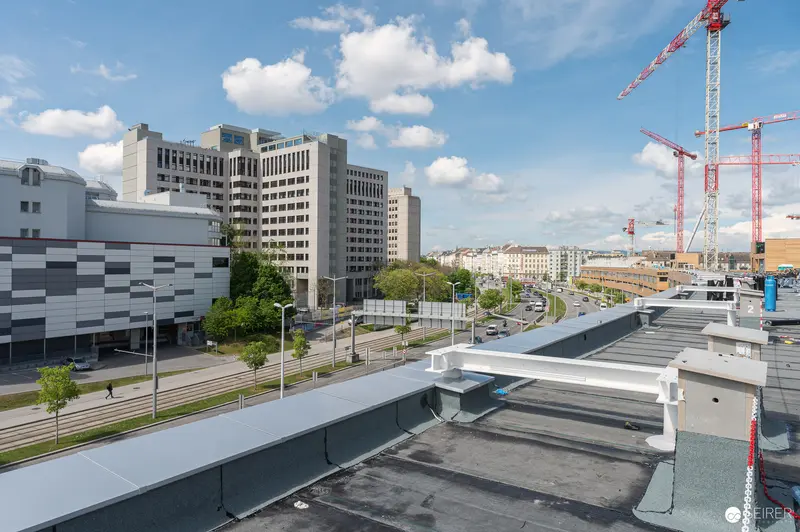 Urban Construction Site Aerial View with Institutional Building and Development Cranes