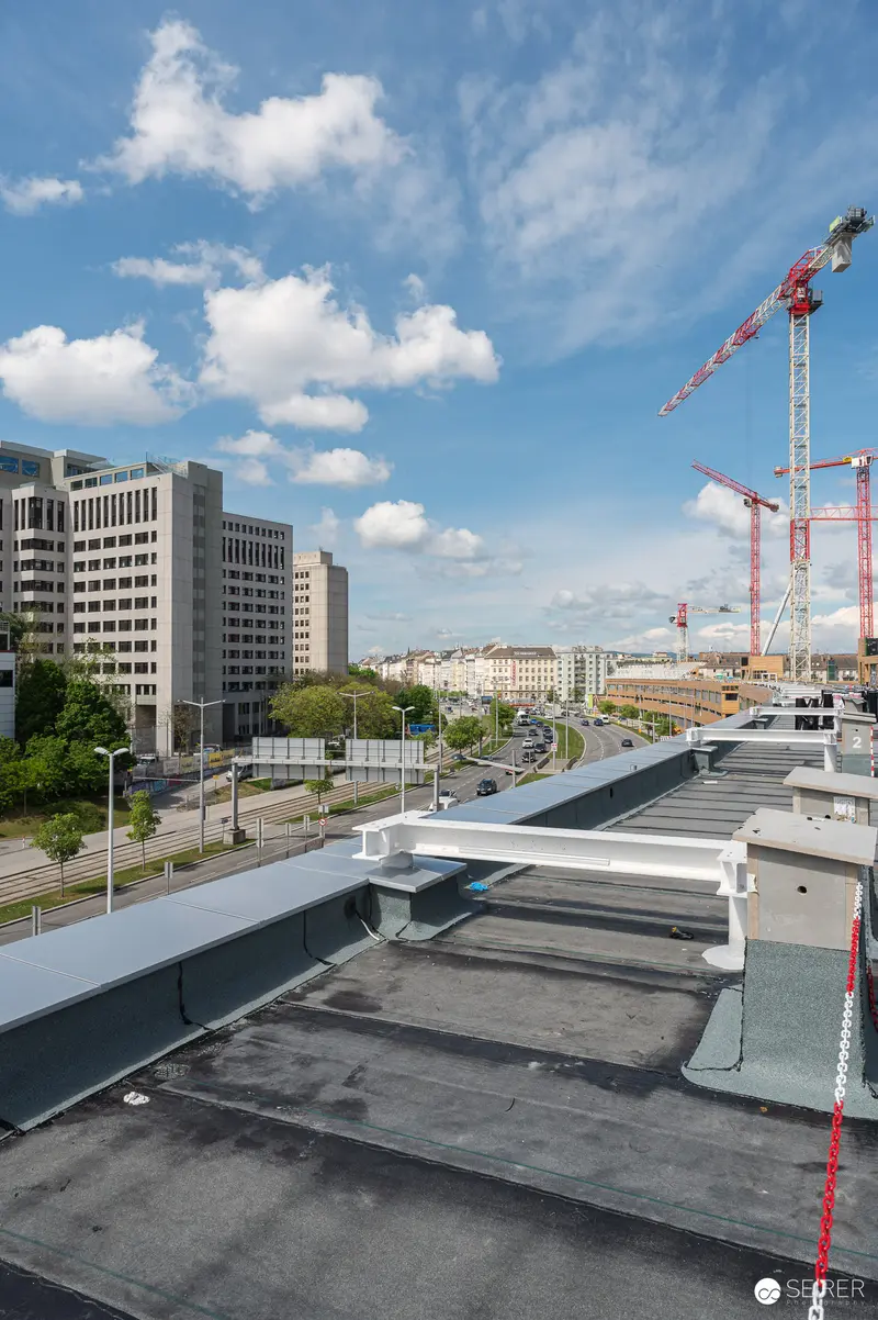 Urban Construction Site Overview from Rooftop Vantage Point