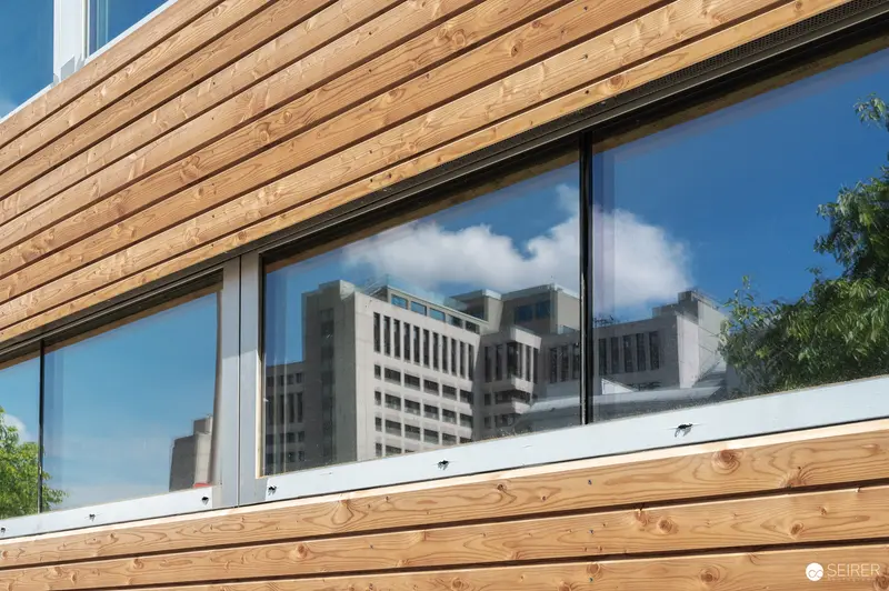 Modern Wooden Cladding and Glazing with Urban Reflections