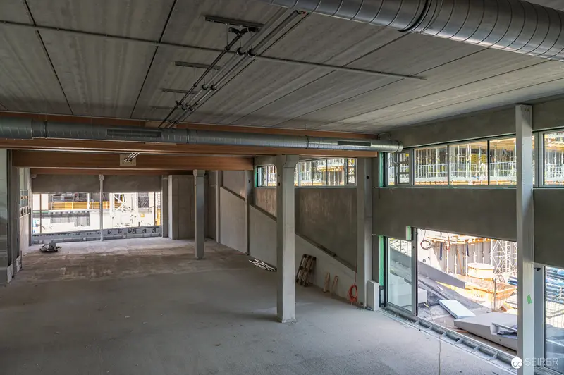 Multi-Level Concrete Interior During Construction Site Tour