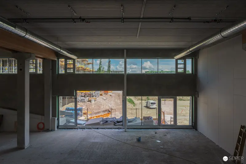 Empty Retail Space Under Construction with Urban Skyline Views