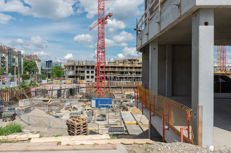 Multi-Crane Construction Site Overview from Elevated Concrete Structure