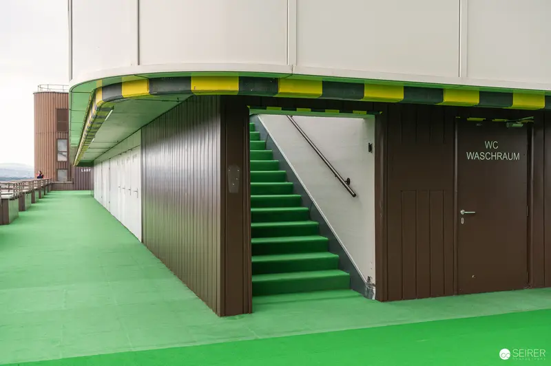 Green Staircase and Washroom in Modern Architectural Design