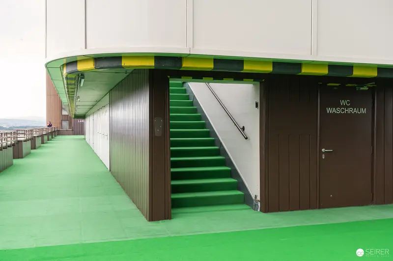 Green Stairwell and Washroom in Modern Architectural Complex