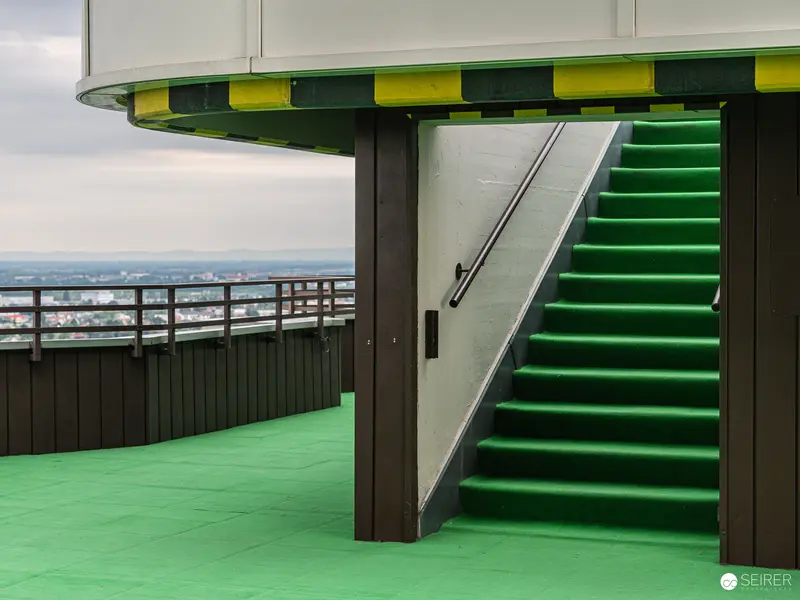 Green Staircase with Urban Panoramic View on Elevated Platform