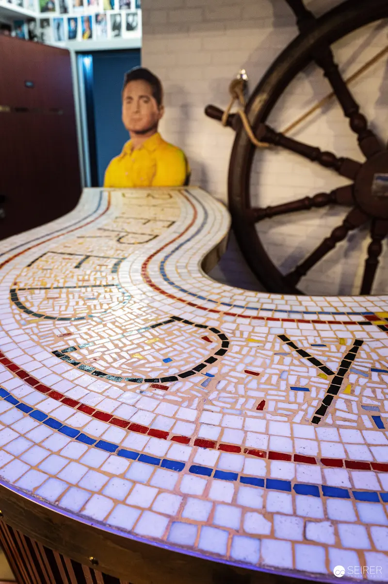 Mosaic Maze Table with Large Steering Wheel in Maritime Setting