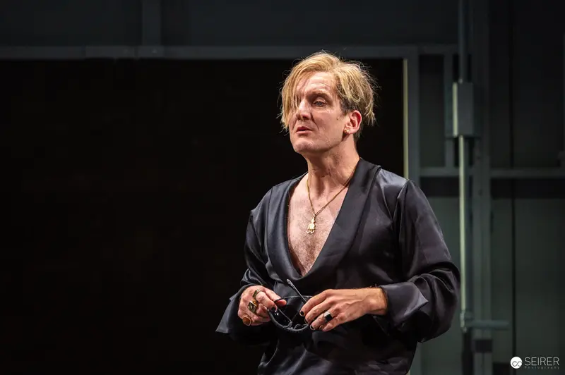 Actor in Dark Robe at Theater in der Josefstadt Production, Vienna 2024