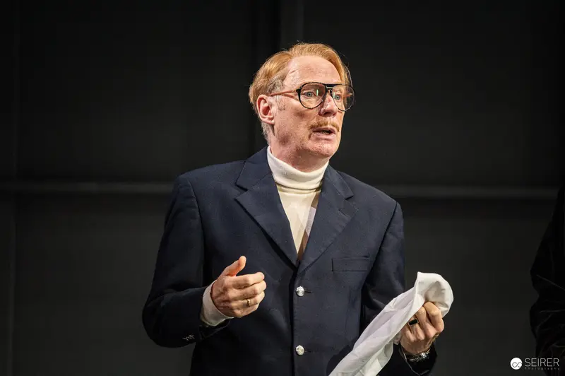Actor in Navy Blazer Rehearses "Trilogie der Sommerfrische" at Theater in der Josefstadt