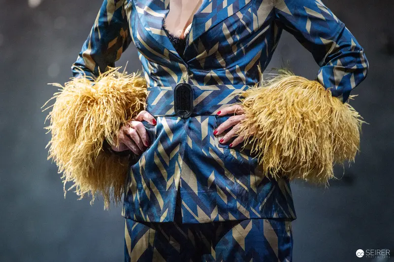 Performer in Geometric Blue Coat with Yellow Feathered Cuffs, Theater in der Josefstadt Rehearsal