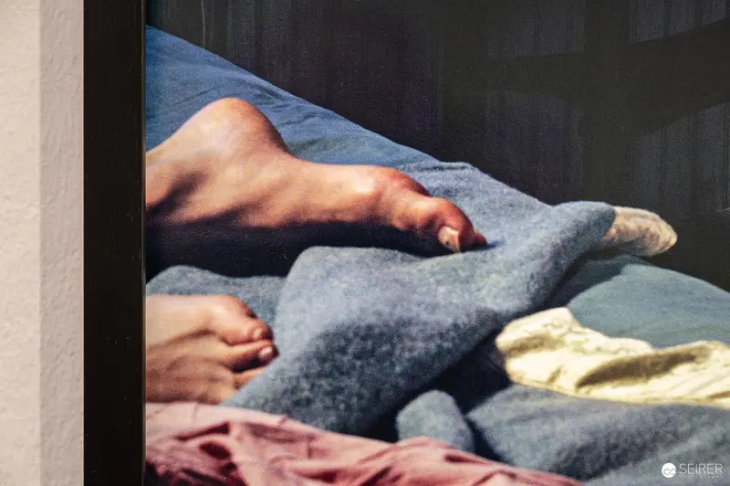 Detail of bare feet and blankets in Gregory Crewdson print at Albertina Vienna