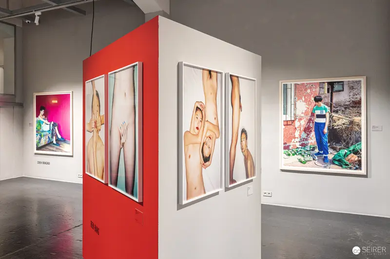 Art Gallery Exhibition of Contemporary Photographic Portraits on Multi-Panel Display