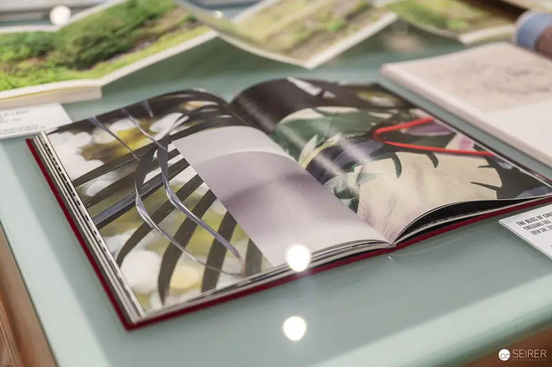 Open Photography Book Displaying Artistic Graphic Design Spread