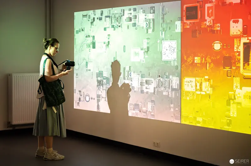 WUK Workshop Participant Examining Technical Projection of Circuit Board Design