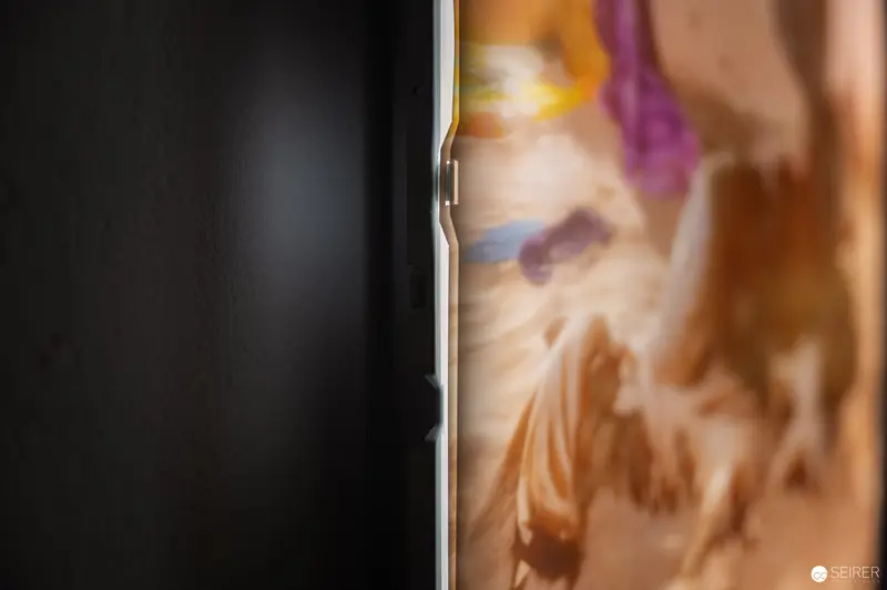 Smartphone Edge Showing Partial Blurred Background in Close-up View