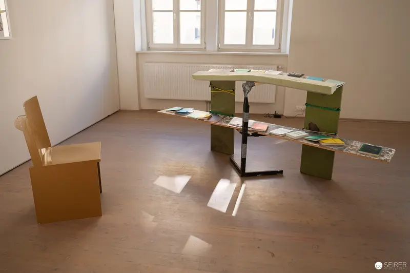 Minimalist Interior with Cardboard Furniture and Scattered Books