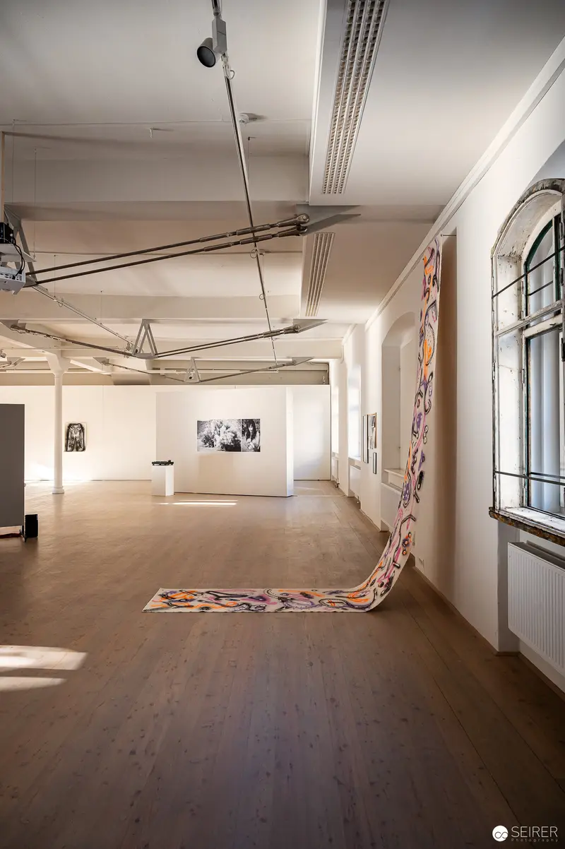 Art Gallery Exhibition with Large Flowing Sculptural Installation on Wooden Floor