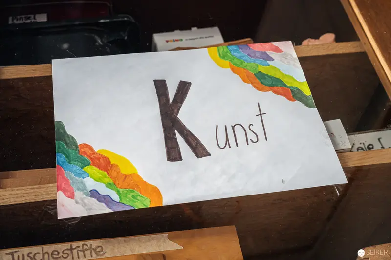 Handmade "Kunst" Sign with Colorful Rainbow-Like Paper Border