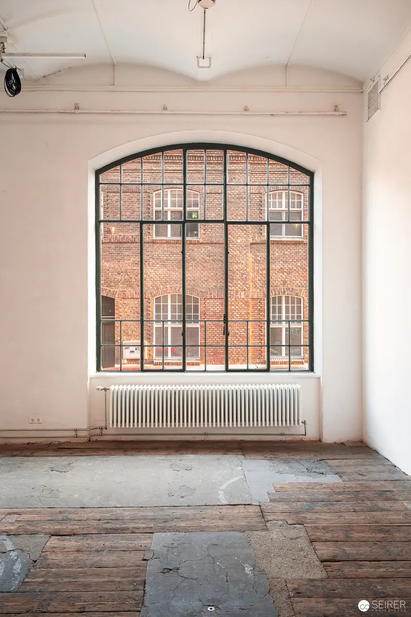 Arched Window with Brick View in Minimalist Interior Space