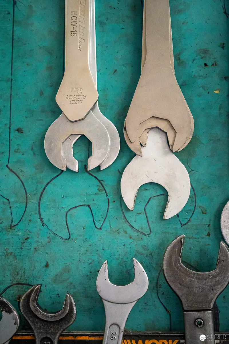 Vintage Open-End Wrenches on Textured Teal Workshop Background