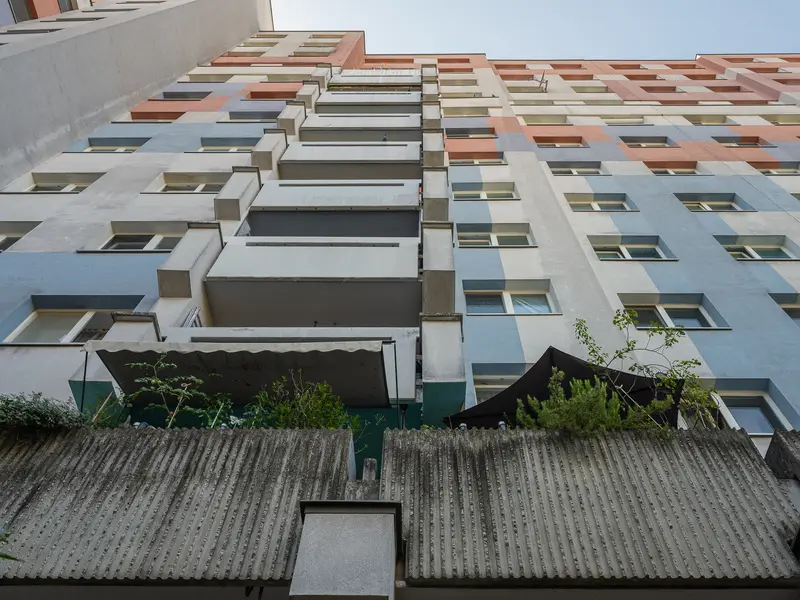 Modernist Residential Complex with Geometric Facade in Urban Setting