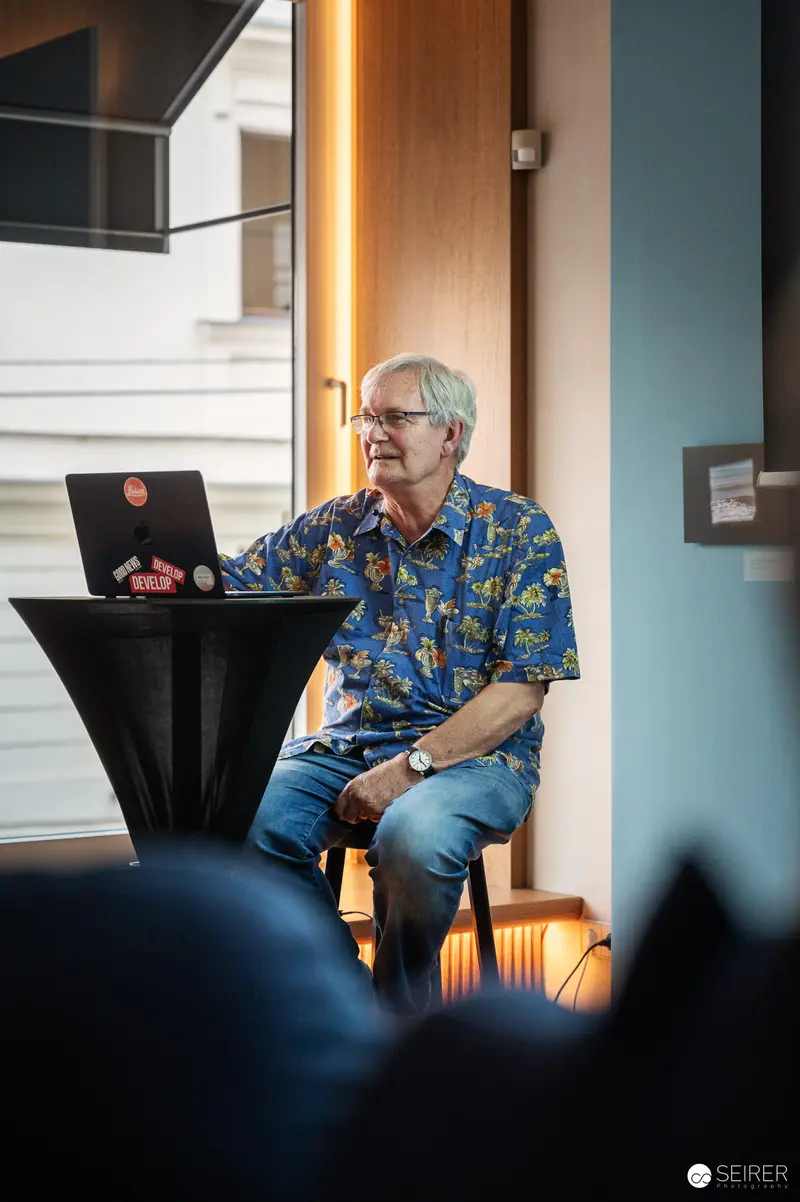 Martin Parr at Leica Gallery Vienna, August 22, 2024. Martin Parr Seated During Artist Talk at Leica Gallery Vienna