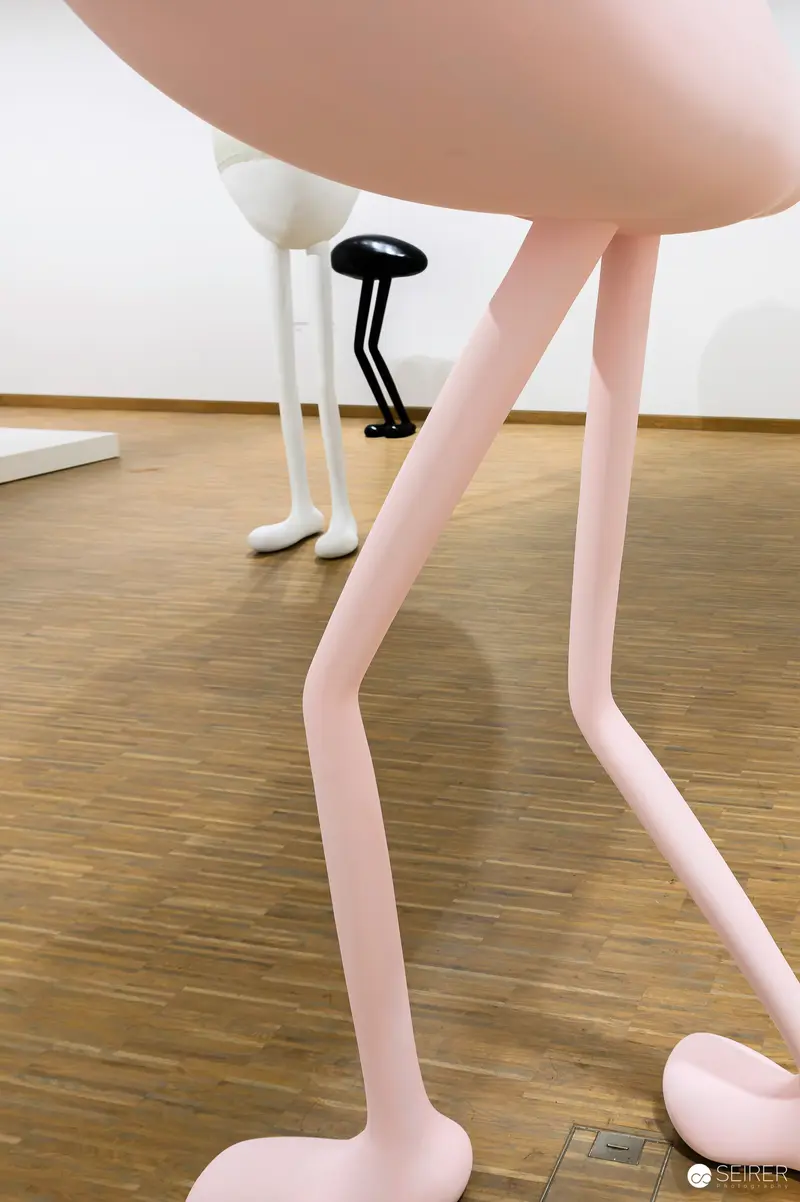 Erwin Wurm Sculpture Depicting Abstracted White Legs on Wooden Floor