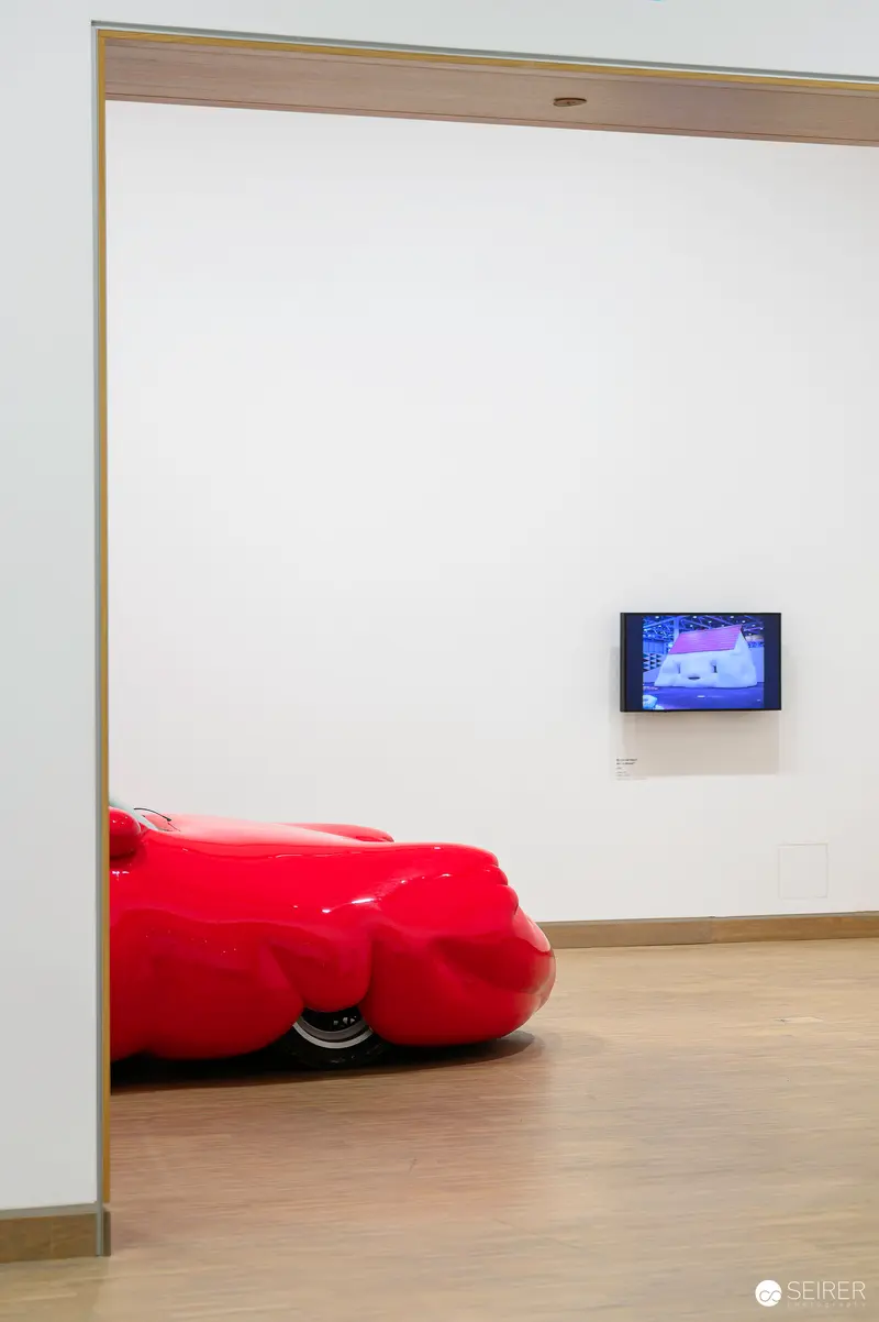 Erwin Wurm's Absurdist Red Sculpture at ALBERTINA MODERN Retrospective