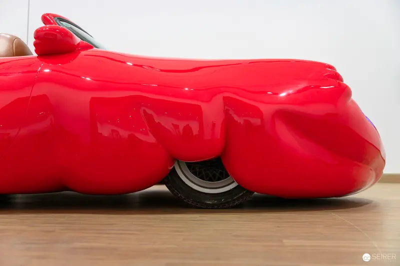Erwin Wurm's Surreal Red Sculptural Object Exploring Bodily Absurdity