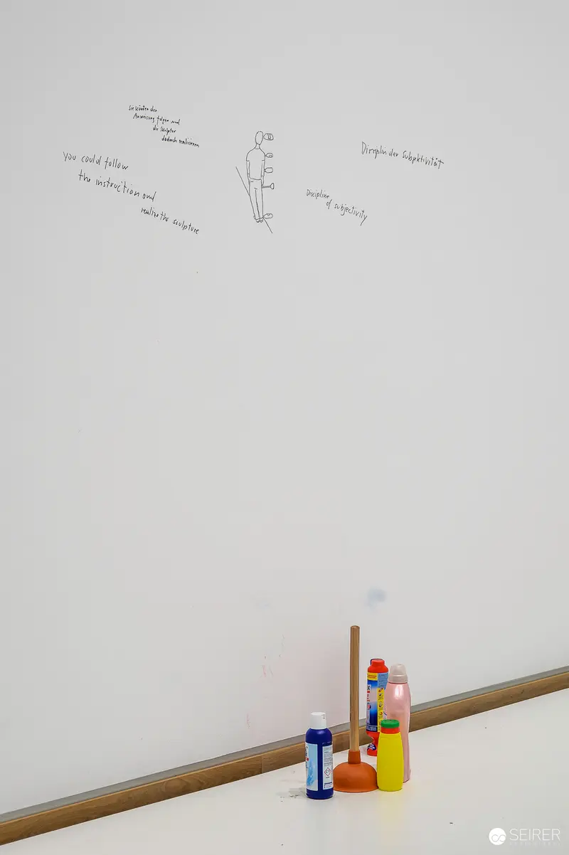 Erwin Wurm's Minimalist Studio Setup with Sketched Figure and Objects