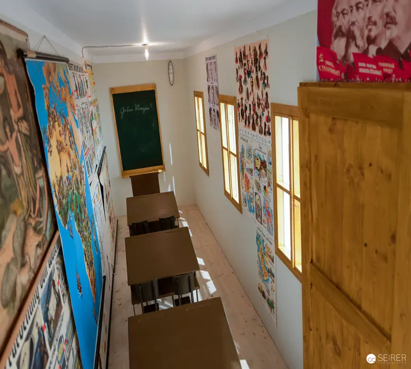 Interior of Exhibition Space Displaying Artwork and Posters