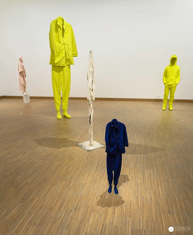 Erwin Wurm's Absurdist Sculptural Figures in Lime Green and Navy Blue