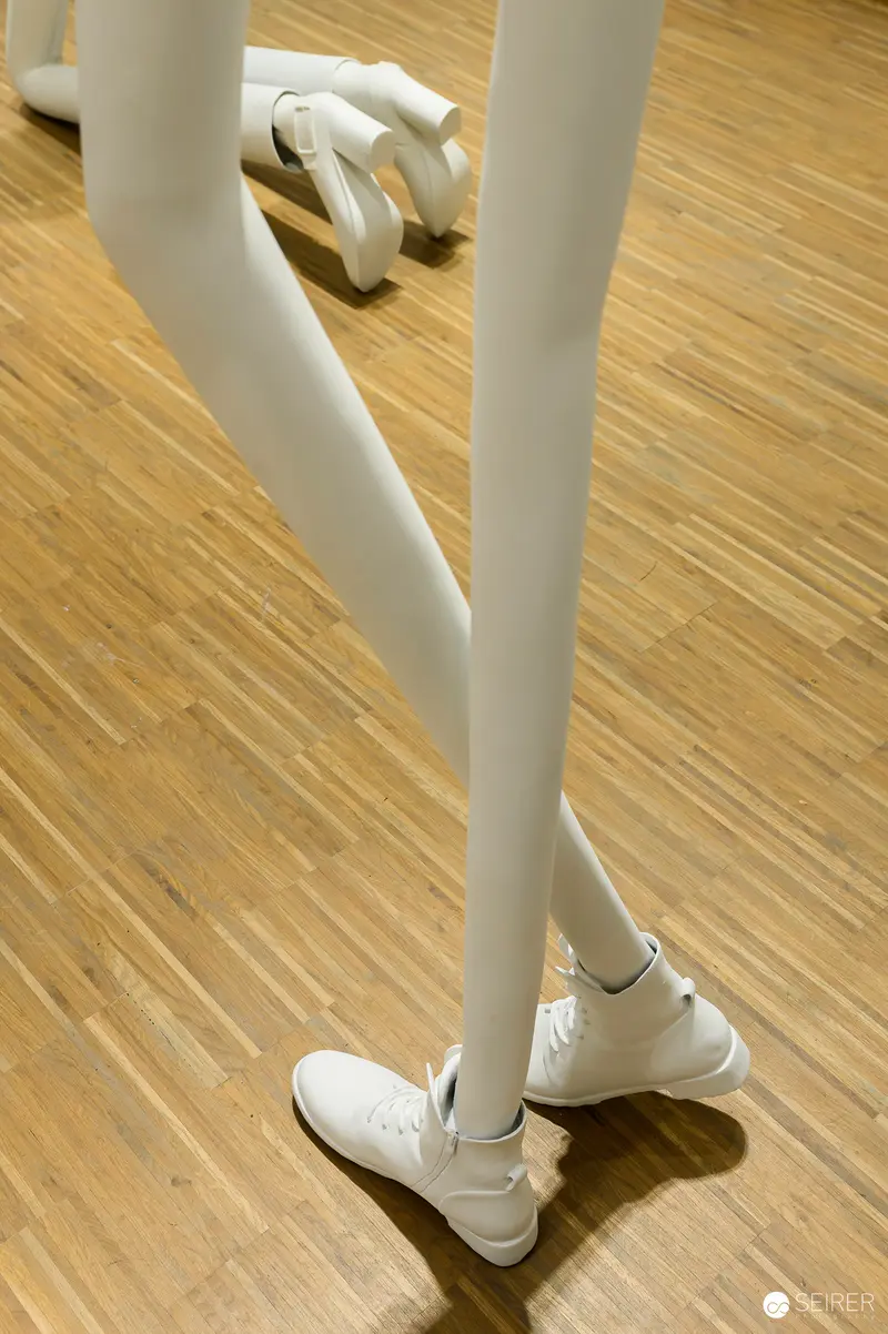 Erwin Wurm Sculpture: White Mannequin Legs on Wooden Floor