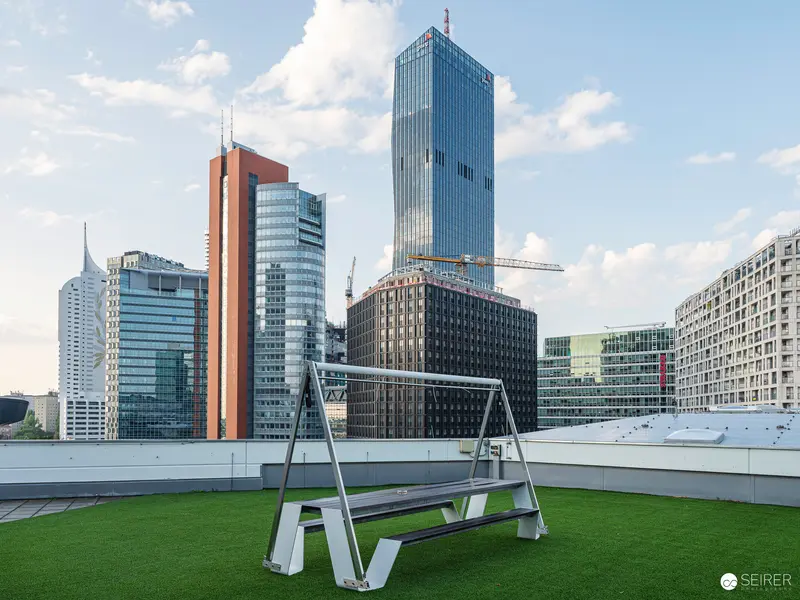 Modern Urban Rooftop Scene with Glass Skyscrapers and Minimalist Swing Bench